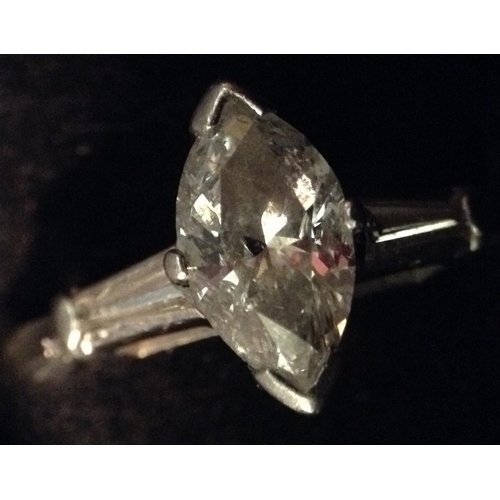 3393 - A marquise solitaire diamond ring, single marquise diamond approx 1.10ct, set above an open shoulder... 