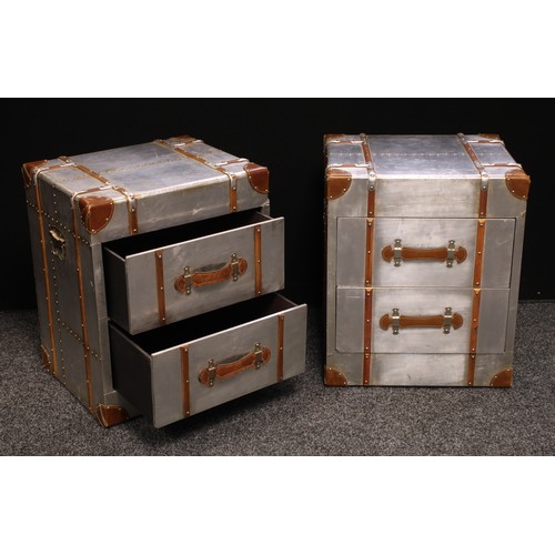 270 - A pair of contemporary bedside cabinets, overlaid with foil, rectangular top above two short drawers... 