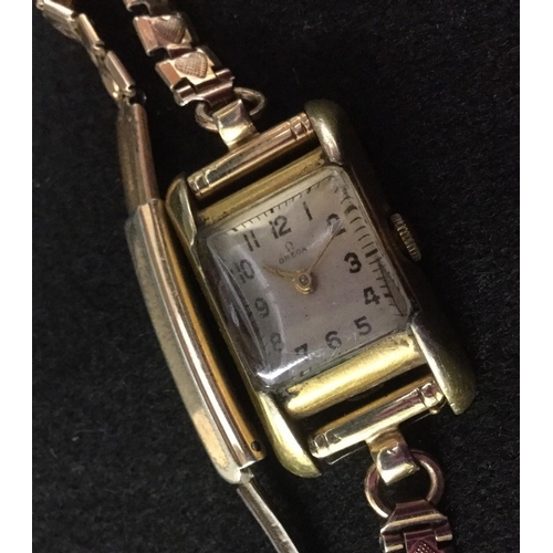 3001A - Omega - a lady's wristwatch, square silvered dial, Arabic numerals, minute track, 15 jewel manual wi... 