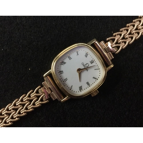 3005A - Omega - a lady's 9ct gold wristwatch, white dial, Roman numerals, minute track, quartz 1455 movement... 