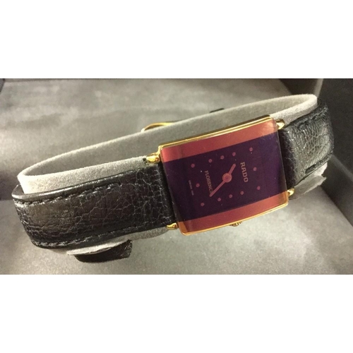 3007A - Rado - a lady's Florence dress watch, black and gilt dial, baton dots, quartz movement, steel case, ... 