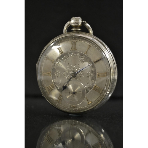 3022 - A Victorian silver dial open face pocket watch, silvered floral dial, Roman numerals, minute track, ... 