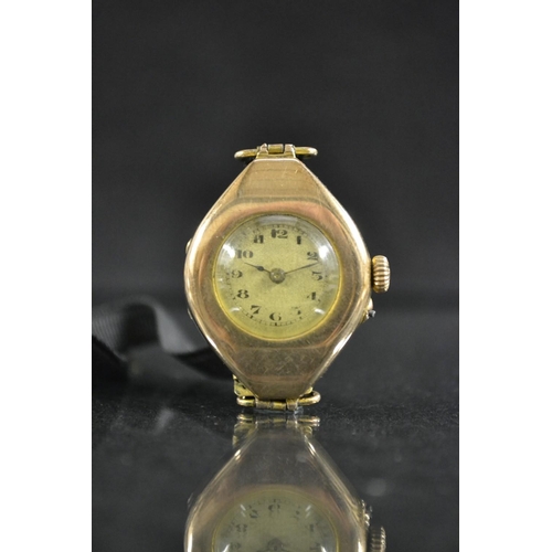 3045 - A vintage lady's 9ct gold wristwatch, oval case, round silvered dial, Arabic numerals, minute track,... 
