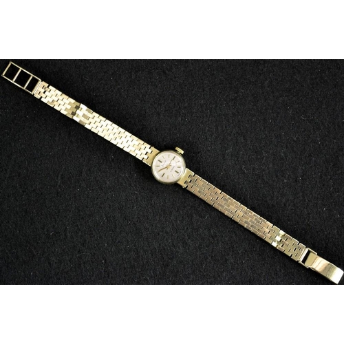 3055 - An Accurist lady's 9ct gold cased wrist watch, silvered dial, baton markers, 21 jewel manual movemen... 