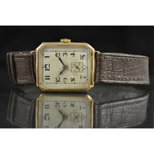 3065 - An Art Deco 1930's 9ct gold cased wrist watch, canted rectangular textured silver dial. Arabic numer... 