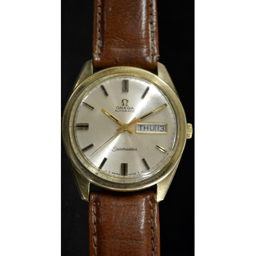 3077 - Omega- a 1960's 9ct gold Seamaster automatic wrist watch, silvered dial, baton markers, minute track... 