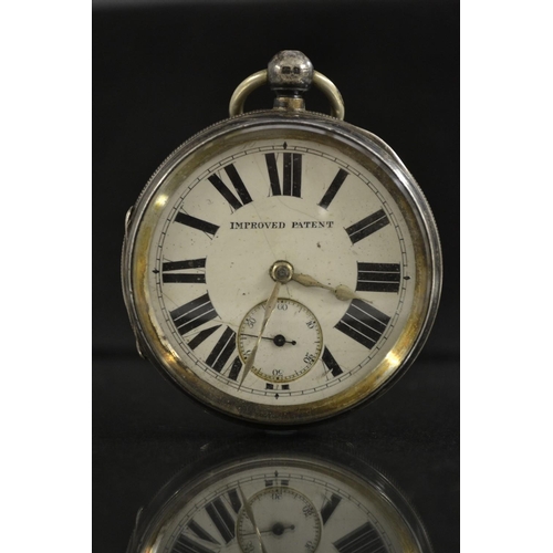 3078 - An Edwardian over size silver open face pocket watch,  white dial, bold Roman numerals, minute track... 