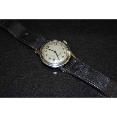 3085 - A Garrards P Buhre vintage stainless steel wrist watch, silvered dial, Arabic numerals, minute track... 