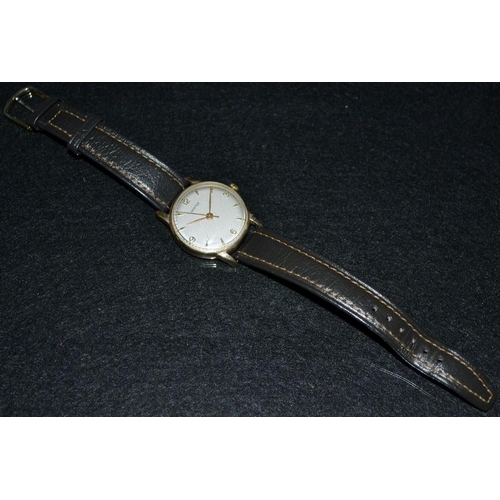 3105 - Vertex - a vintage 1950's 9ct gold cased wrist watch, silvered dial, Arabic quartered numerals, arro... 