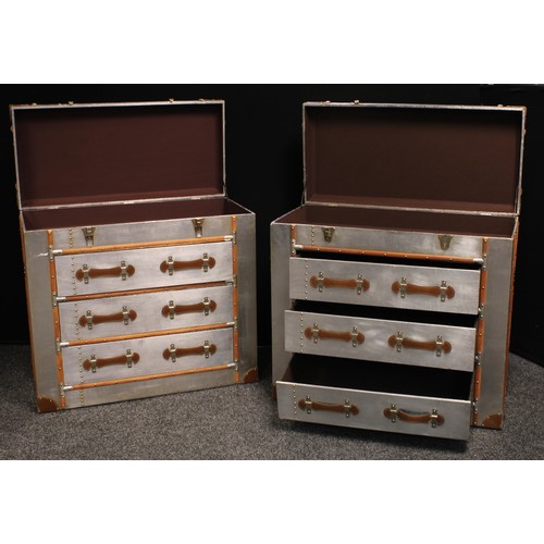 407 - A pair of contemporary chest of drawers as a traveling trunk, hinged top above three long drawers, o... 