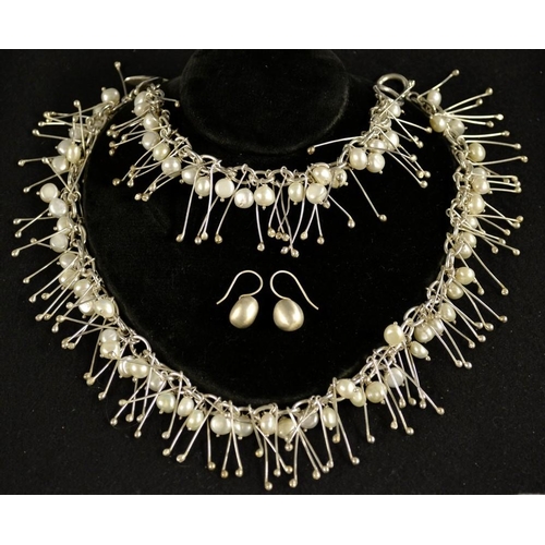 3150 - A Silvarious demi parure pearl and silver suite, comprising a contemporary pearl and wire droplet fr... 