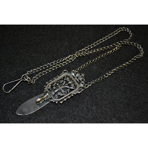 3153 - A Continental silver coloured metal chatelaine, rectangular floral top panel with hinged slide clip,... 