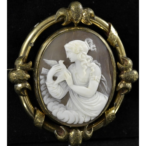 3155 - A 19th century Victorian shell cameo brooch, central revolving oval shell panel carved with seated P... 