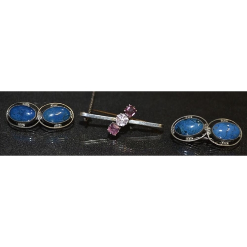 3158 - A pair of lapis lazuli and silver cufflink's, each terminal inset with an oval cabochon, silver moun... 