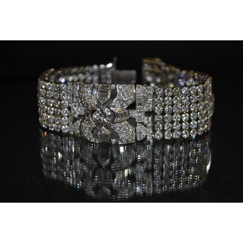 3412 - An impressive Art Deco diamond encrusted bracelet, inset with a round brilliant cut diamond approx 1... 