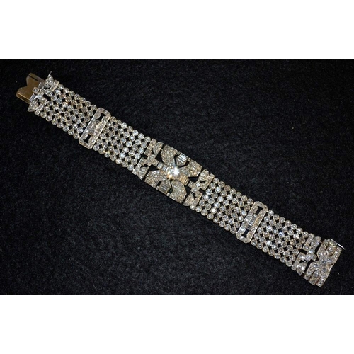 3412 - An impressive Art Deco diamond encrusted bracelet, inset with a round brilliant cut diamond approx 1... 