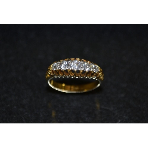 3428 - An early 20th century diamond ring, five graduated round old brilliant cut diamonds, total estimated... 