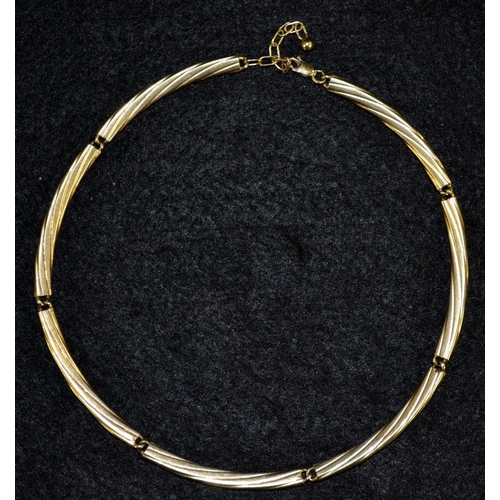 3429 - A contemporary 9ct gold hollow link necklace, composed of seven twisting tubular bar links, stamped ... 