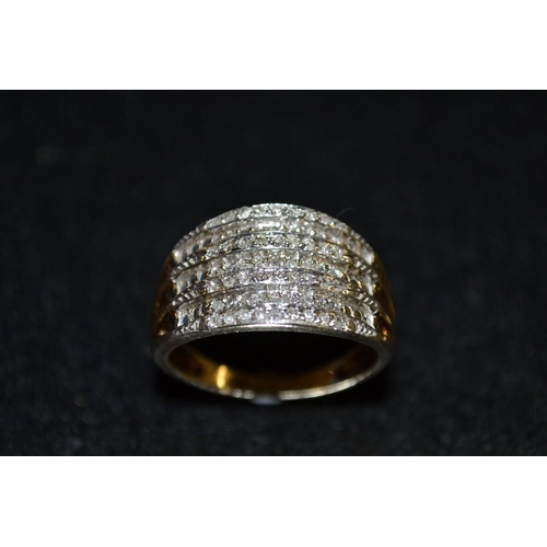 3430 - A diamond cluster ring, seven alternating ridged platform pave encrusted with diamond accents, 9ct g... 