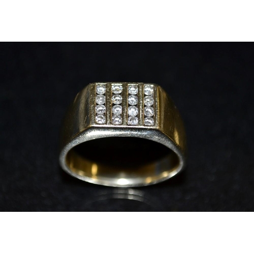 3444 - A Gentleman's sixteen stone signet ring, rectangular platform of four rows of four round cut diamond... 