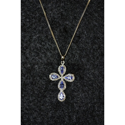 3456 - A tanzanite and 9ct gold cross pendant necklace, white gold mount and chain, stamped 375, 44cm long,... 