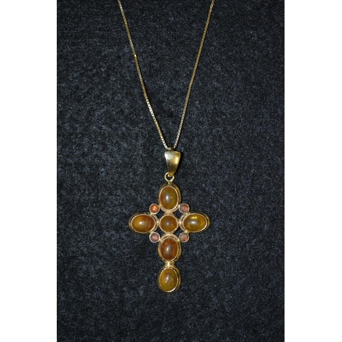 3464 - A 14ct gold and copal bead cross pendant, composed of five oval and five circular copal cabochons, 1... 