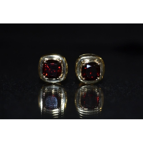 3468 - A pair of garnet and 9ct gold earrings, circular red garnets, quarter claw set, 9ct gold mount and p... 