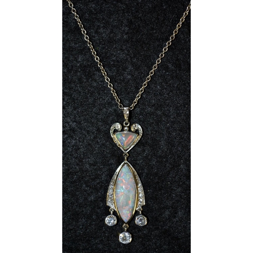 3473 - A black opal and diamond pendant necklace, heart shaped top suspending an oval droplet, set with a c... 