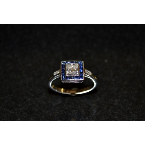 3478 - A diamond and blue sapphire Art Deco cluster ring, central prince cut diamond surrounded by sixteen ... 