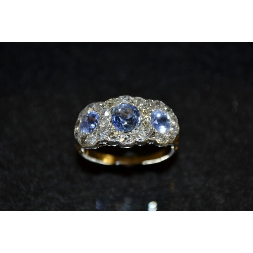 3482 - A pale blue sapphire and diamond cluster ring, three individually set pale blue sapphires, each surr... 