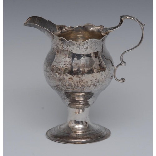 67 - A George III silver ogee shaped cream jug, double scroll handle, 9.5cm high, London 1774, 2.6oz