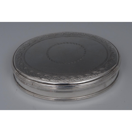 69 - A George III silver oval tobacco box, stand-away hinged cover centred by a vacant cartouche, bright-... 