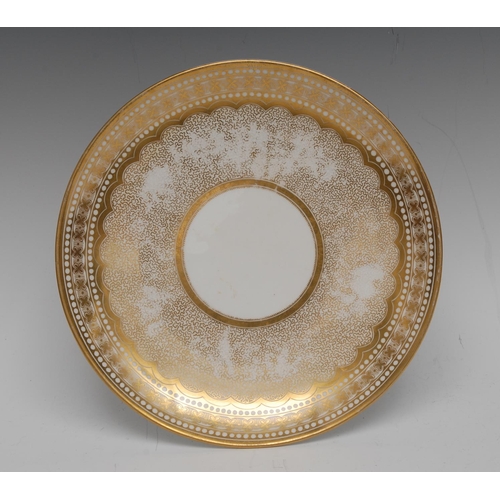 202 - A Swansea circular plate,  decorated in gilt with wrigglework, the banded border with flowerheads, 2... 