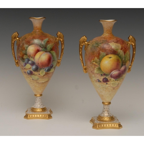 111 - A pair of Lynton two-handled pedestal vases, painted by T G Abbotts, signed, with ripe fruit on a mo... 