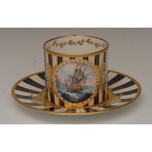 120 - A Lynton porcelain coffee can and stand, painted by Stefan Nowaki, signed, with sailing galleon in c... 