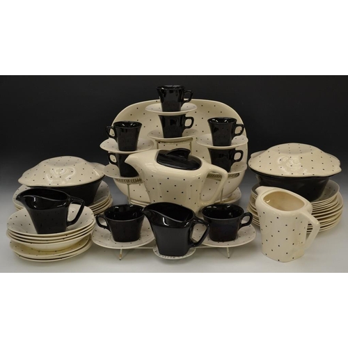 3068 - A 1950s J&G Meakin Domino pattern part dinner and coffee service, the cube shaped teapot with angula... 