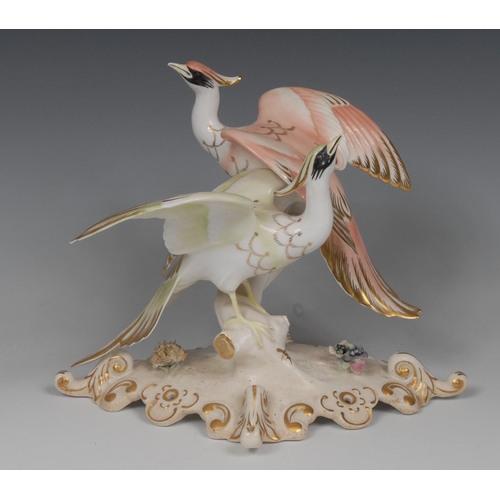 88 - A Royal Crown Derby model of Twin Chelsea Birds, standing on a branch with wings partly stretched, d... 