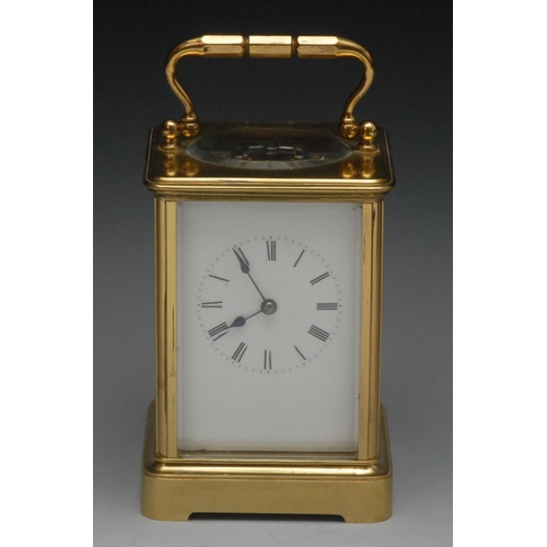 1577 - A brass carriage alarm clock, 5cm dial white enamelled dial, Roman numerals, swing handle, 17cm high... 