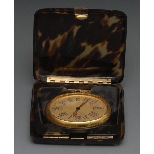 1594 - An Art Deco 'tortoiseshell' travelling timepiece, 4.5cm oval dial with Arabic numerals, keyless move... 