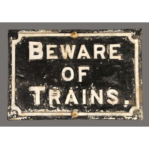 1622 - Railwayana - a cast iron Railway sign, BEWARE OF TRAINS, 39cm x 56cm, mounted on a post