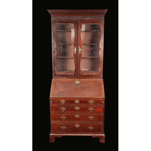 1650 - A 19th century mahogany bureau bookcase, dentil cornice and blind fretwork frieze above a pair of sh... 