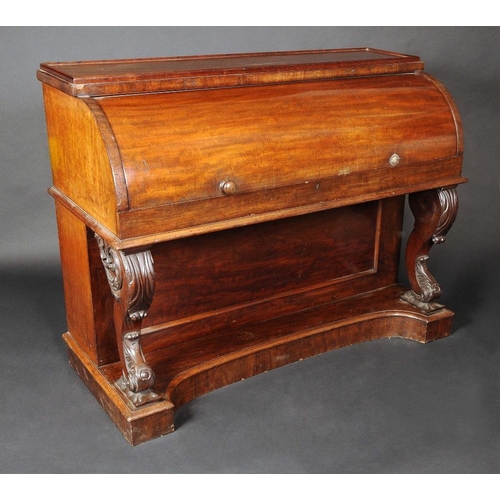 1651 - A 19th century mahogany cylinder desk, the retractable front enclosing a sliding writing surface wit... 