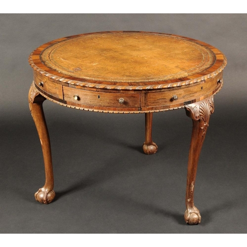 1656 - A 19th century rosewood and mahogany drum table, the crossbanded top with tooled and gilt leather wr... 