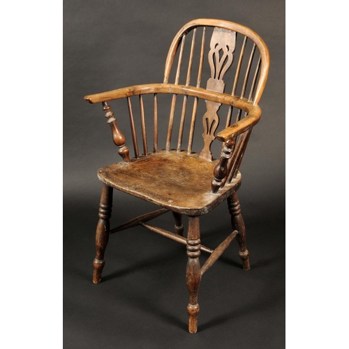 1660 - A 19th century yew and elm Windsor elbow chair, low hooped back, shaped and pierced splats, saddle s... 