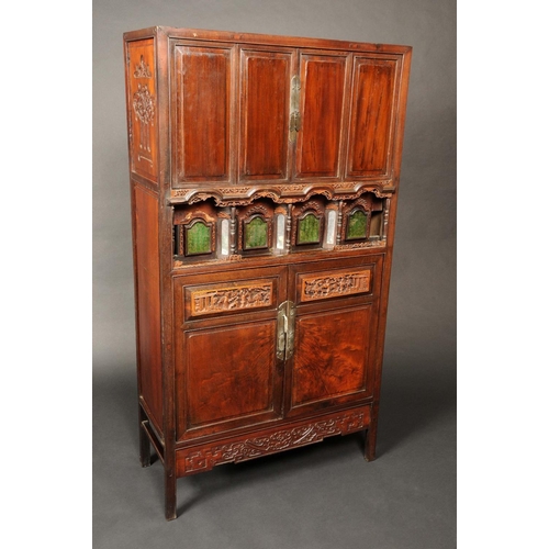 1668 - A Chinese padouk wood side cabinet, the top with two pairs of rectangular raised panel doors, above ... 