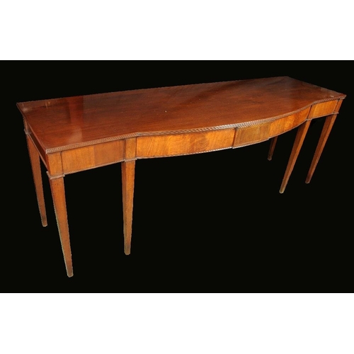 1696 - A George III mahogany bow centre serving table, moulded top above a deep frieze, tapered square legs... 