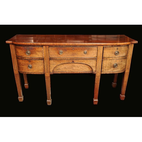 1697 - A George III mahogany bow fronted sideboard, crossbanded top above a cockbeaded frieze drawer and ar... 