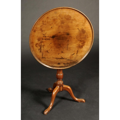 1711 - A George III mahogany tripod occasional table, circular tilting dished top, turned urnular column, c... 