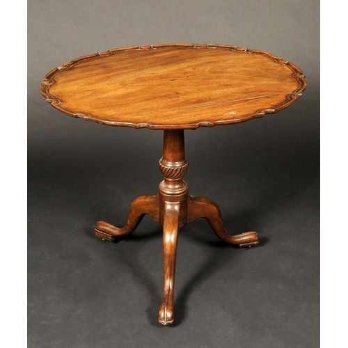 1714 - A George III mahogany tripod supper table, dished tilting top with piecrust border, turned fluted co... 