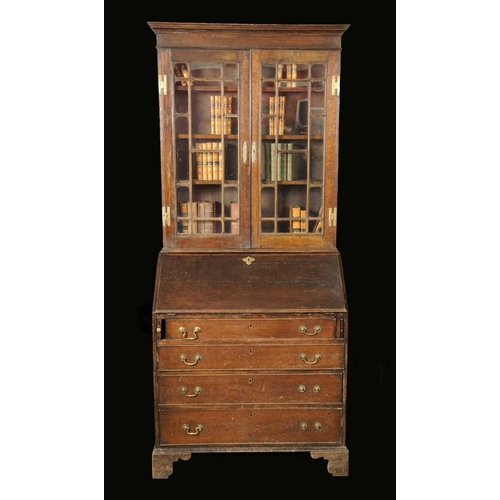 1716 - A George III oak bureau bookcase, stepped cornice above a pair of glazed rectangular doors, fall fro... 